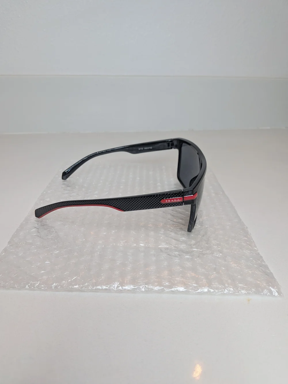 Prada Men’s Black Shield Sunglasses Red Logo Sport